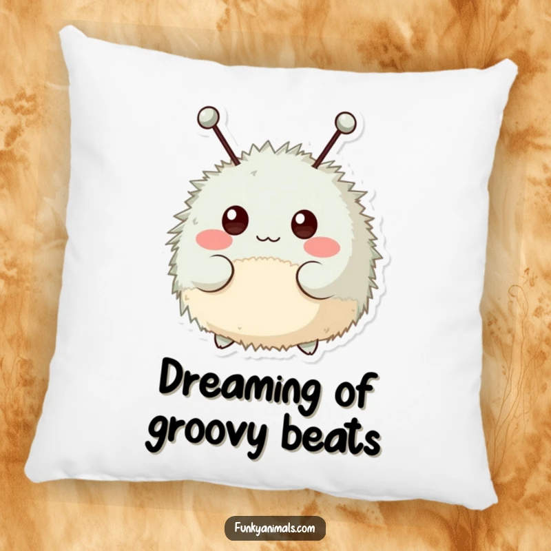 Funny pillow featuring a fuzzy, round creature with antennae happily bopping its head to a beat.