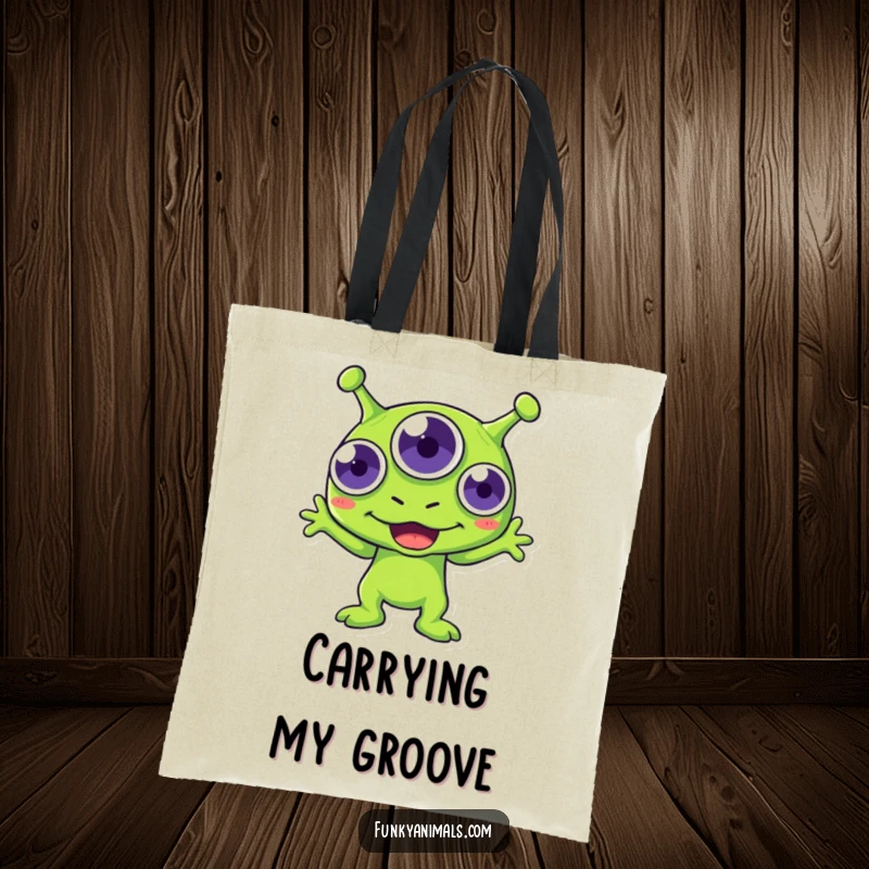 Funny green alien tote bag, three-eyed creature boogying with infectious enthusiasm, practical and humorous.