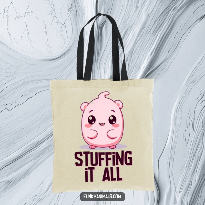 Funny tote bag with a pink, squishy creature and googly eyes wiggling its body, designed for carrying items with quirky charm.
